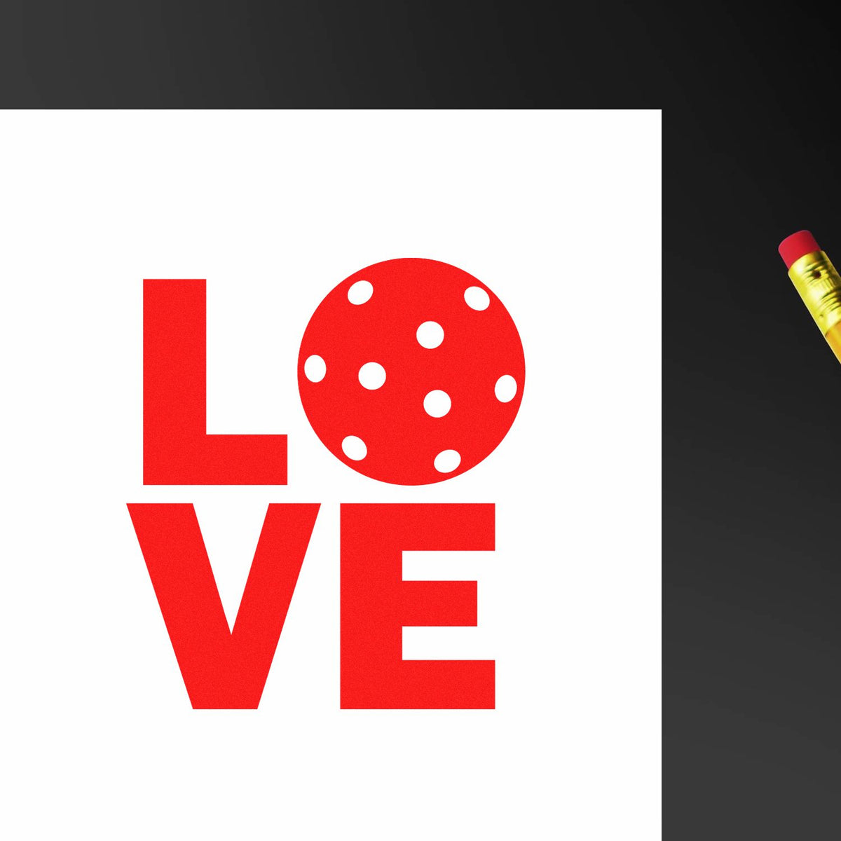 Red LOVE stamp on white card with polka-dot O, beside a gold seal tool on a dark background.
