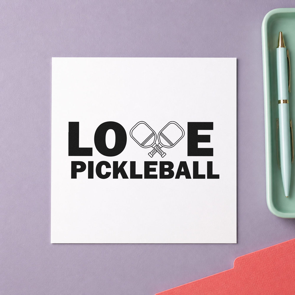 Love Pickleball Crossed Paddles craft stamp imprint in black ink on a handmade project, one idea being paddle gift tags.