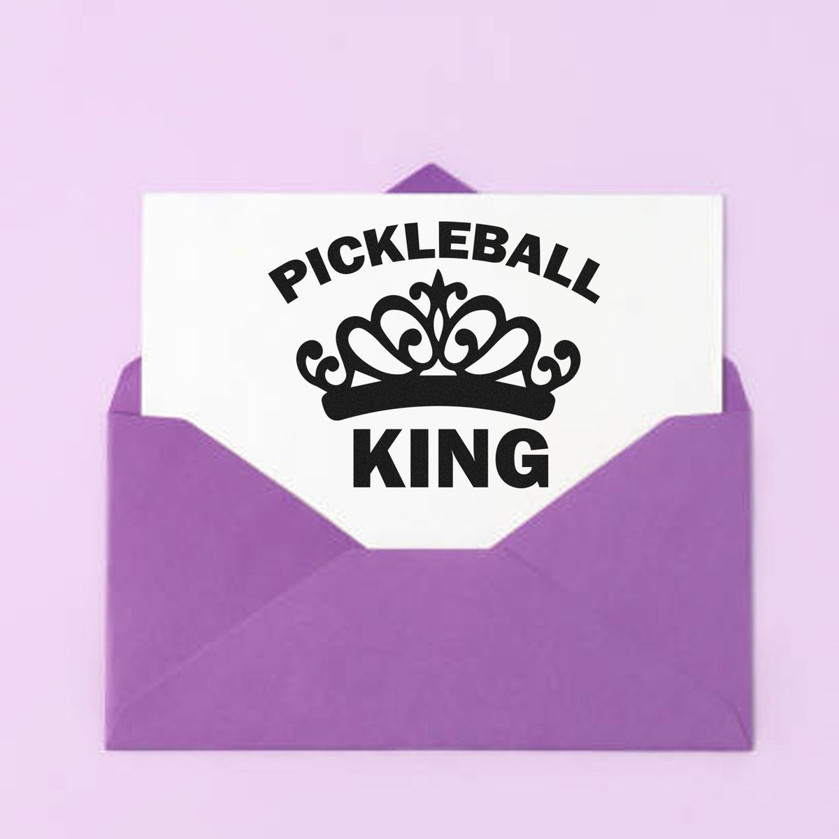 Purple envelope with a white custom stamp seal card, black crown graphic, and bold PICKLEBALL KING text.