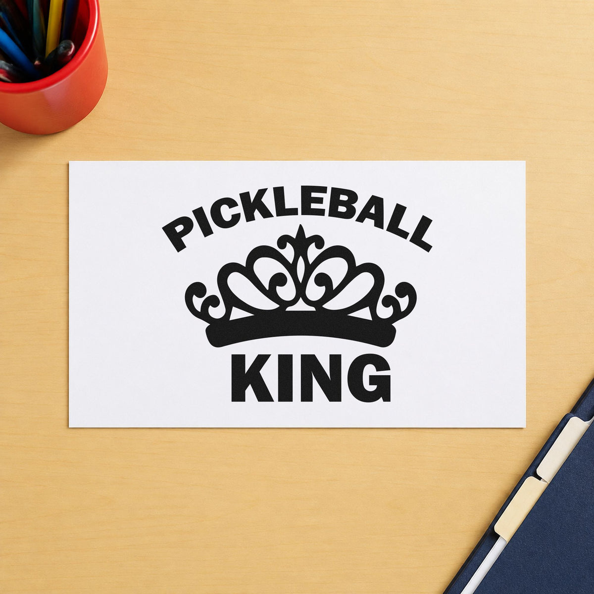 Pickleball King Crown Graphic craft stamp imprint in black ink on a handmade project, one idea being partner gift tags.