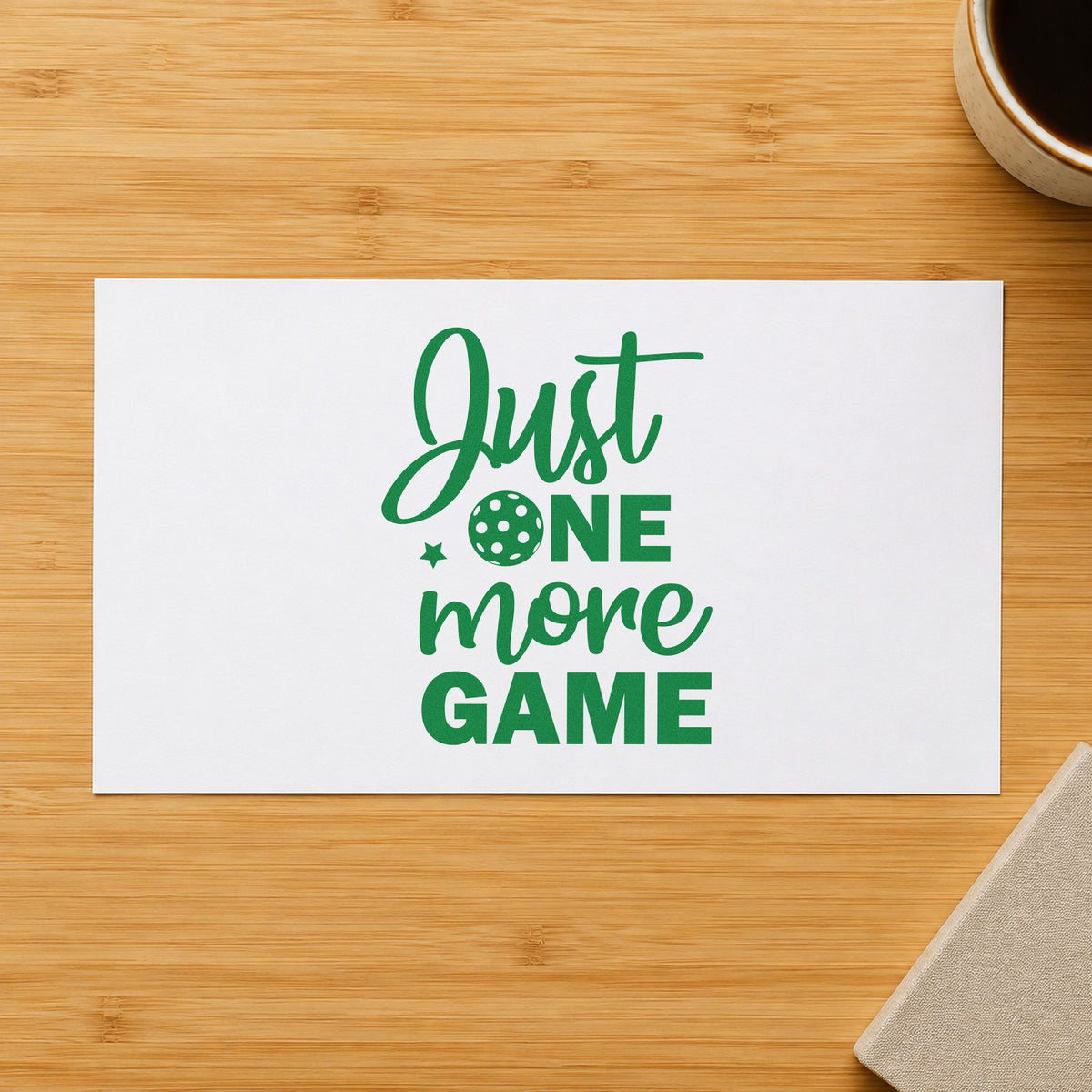 Just One More Game craft stamp imprint in green ink on a handmade project, one idea being rotation rule cards.