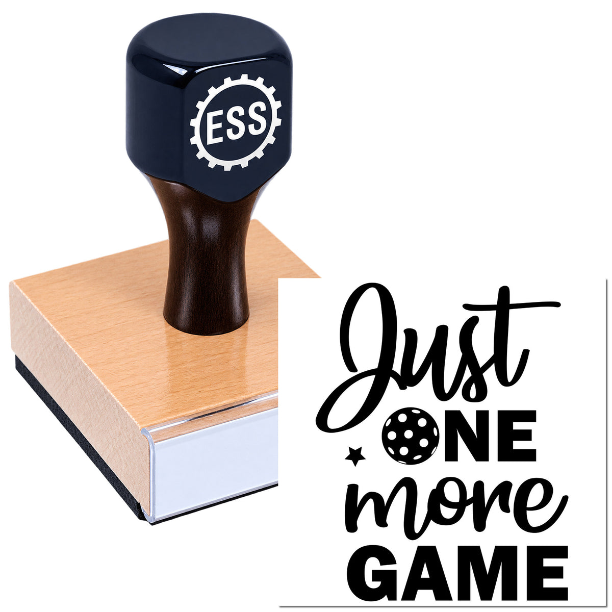 Black rubber stamp seal on a pink wooden block, with bold black "Just one more game" text on white.
