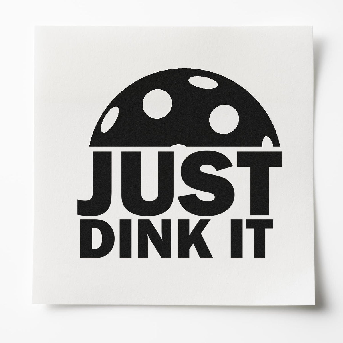 Black JUST DINK IT stamp and seal design with polka-dot mushroom cap on white paper