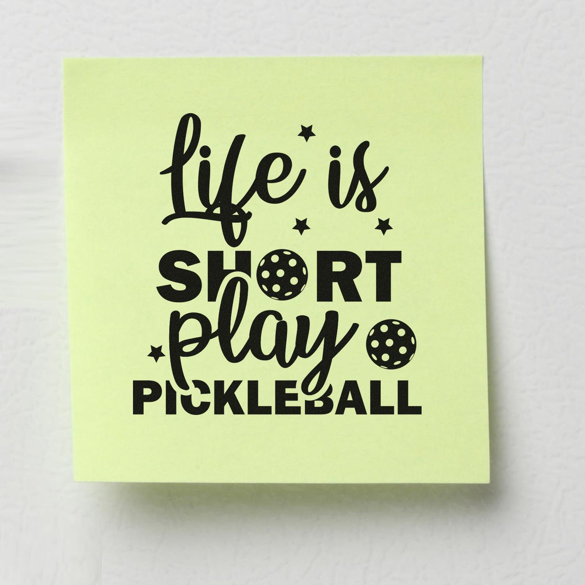 Lime green stamp design with black life is short play pickleball text, stars, and pickleball icons.