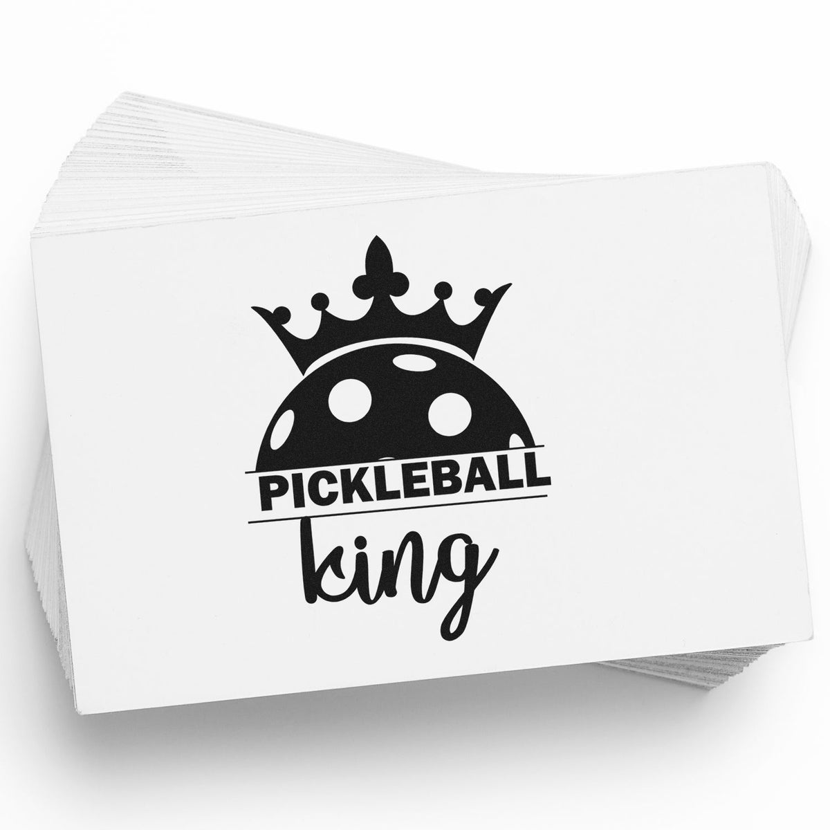 Black pickleball king stamp and seal design with crown and pickleball graphic on stacked white cards.