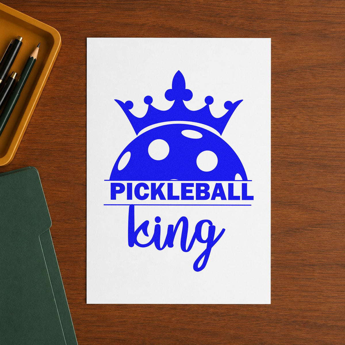 Pickleball King Crowned Ball craft stamp in blue ink on cardstock, an easy option for table runner printing.