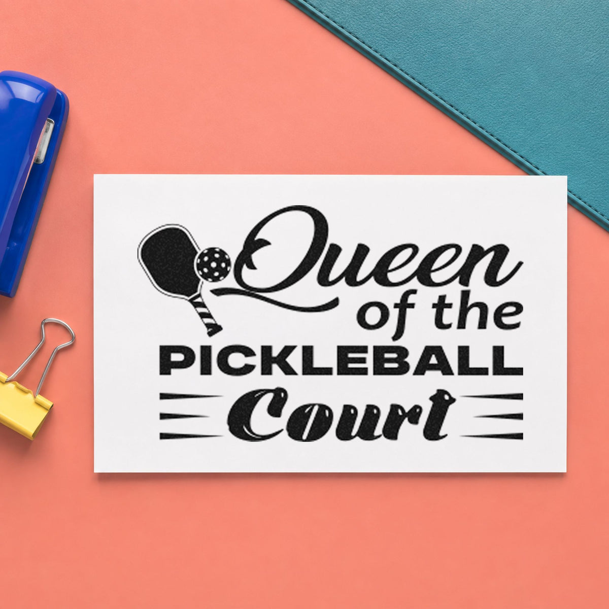 Queen Of Pickleball Court craft stamp imprint in black ink on a handmade project, one idea being plaque gift tags.