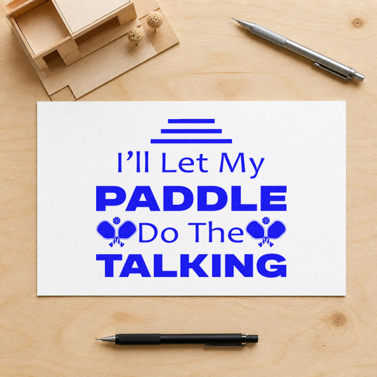 Paddle Do The Talking craft stamp imprinted in blue ink on paper, a design suited to framed garage hook.