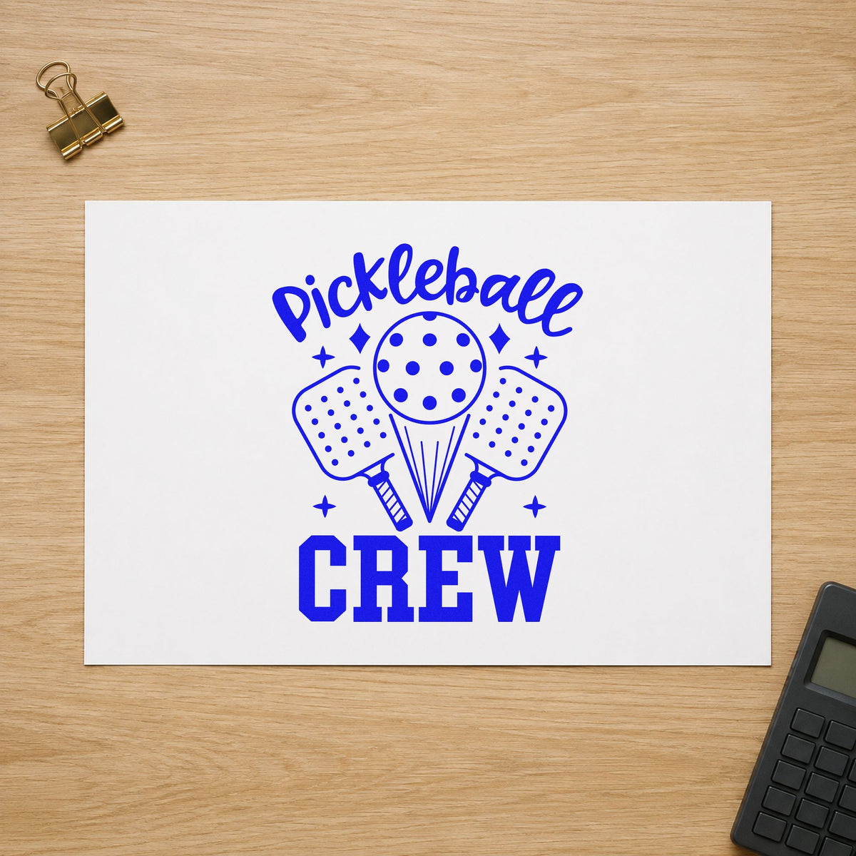 Pickleball Crew Paddles Ball craft stamp in blue ink on cardstock, an easy option for group tee printing.