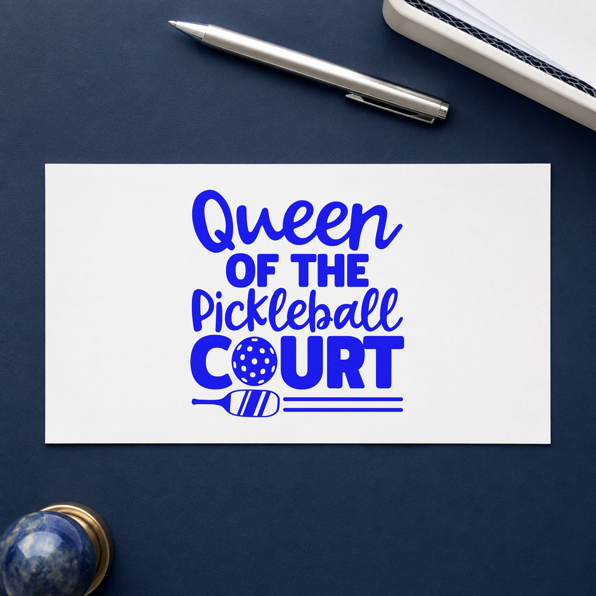 Queen Of Pickleball Court craft stamp in blue ink on cardstock, an easy option for visor panel printing.