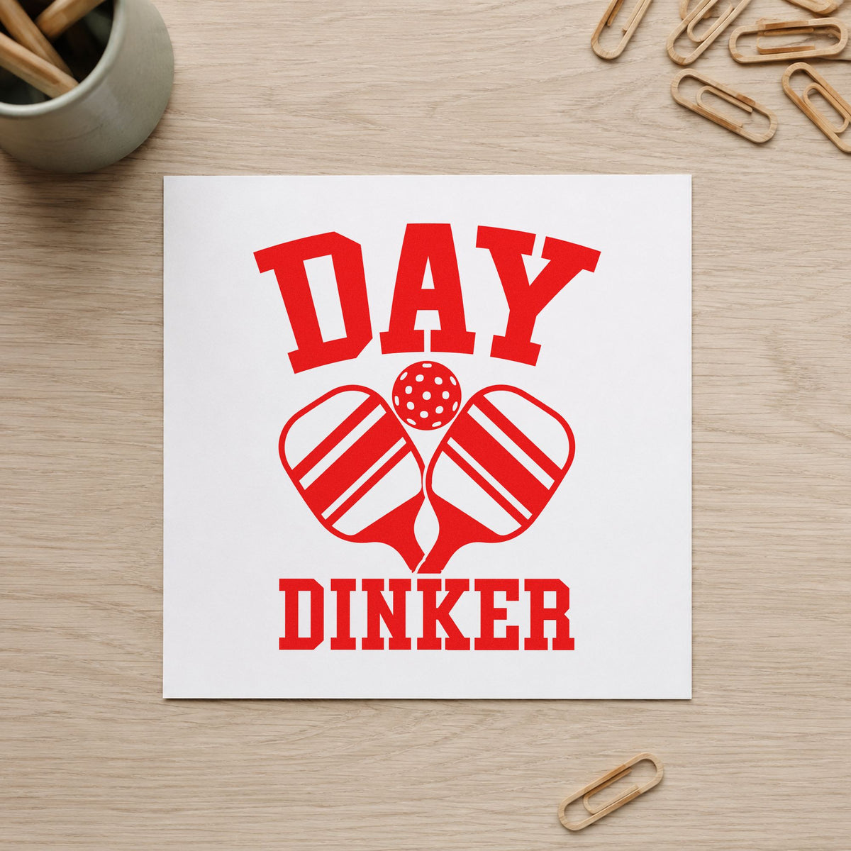 Day Dinker Crossed Paddles craft stamp imprint in red ink on a handmade project, one idea being season info cards.