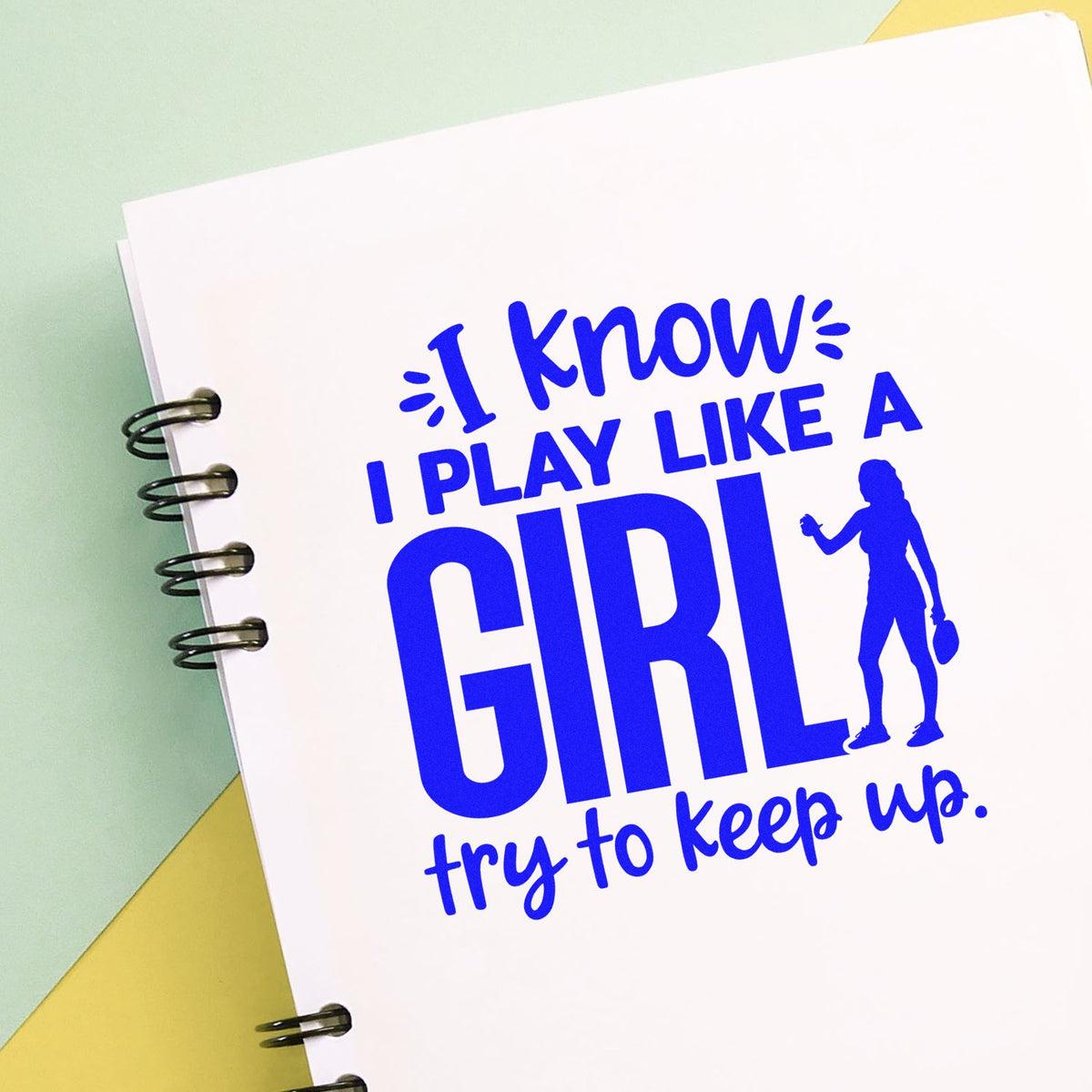 Blue custom stamp design on white spiral notebook: I know I play like a girl, try to keep up with female golfer silhouette.