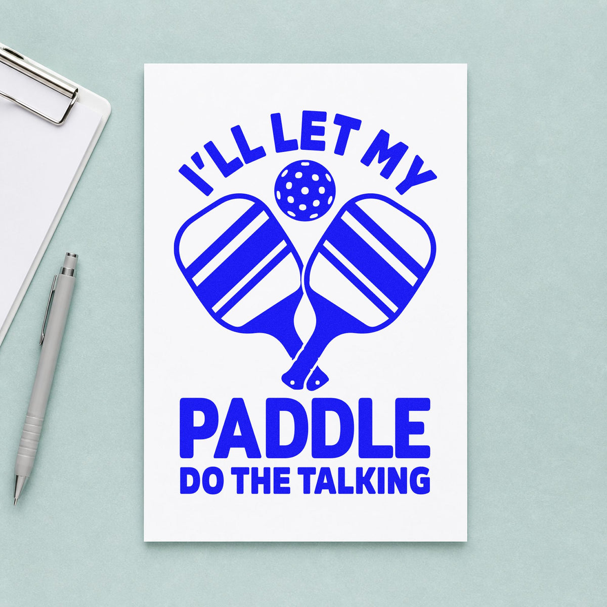 Let Paddle Do Talking craft stamp imprinted in blue ink on paper, a design suited to framed work bench.