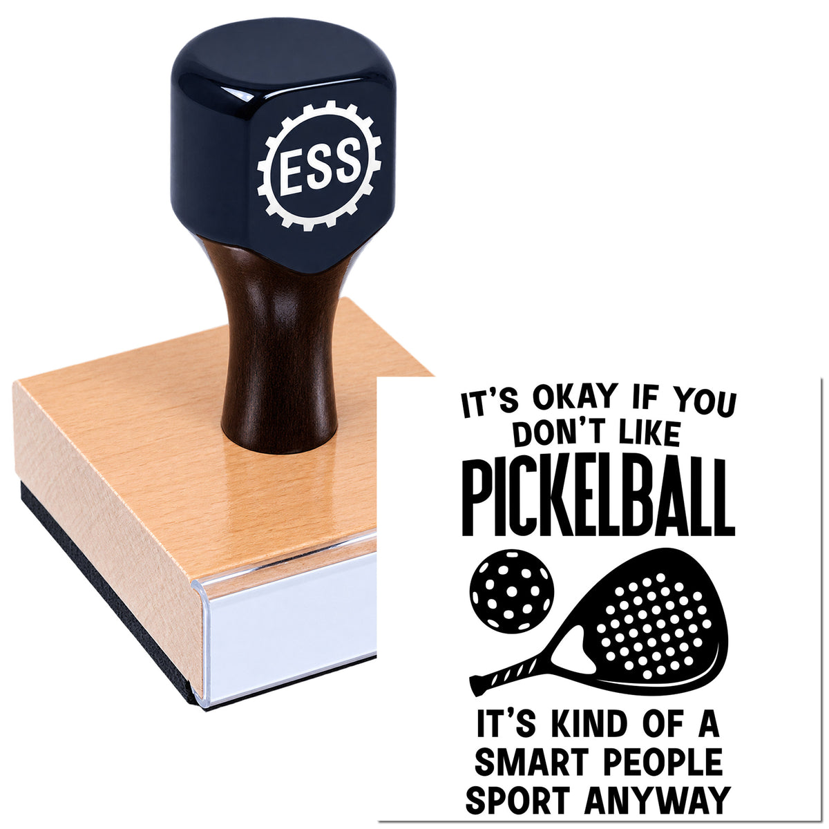 Navy ESS rubber stamp seal on a wooden block beside a black-and-white pickleball slogan print.