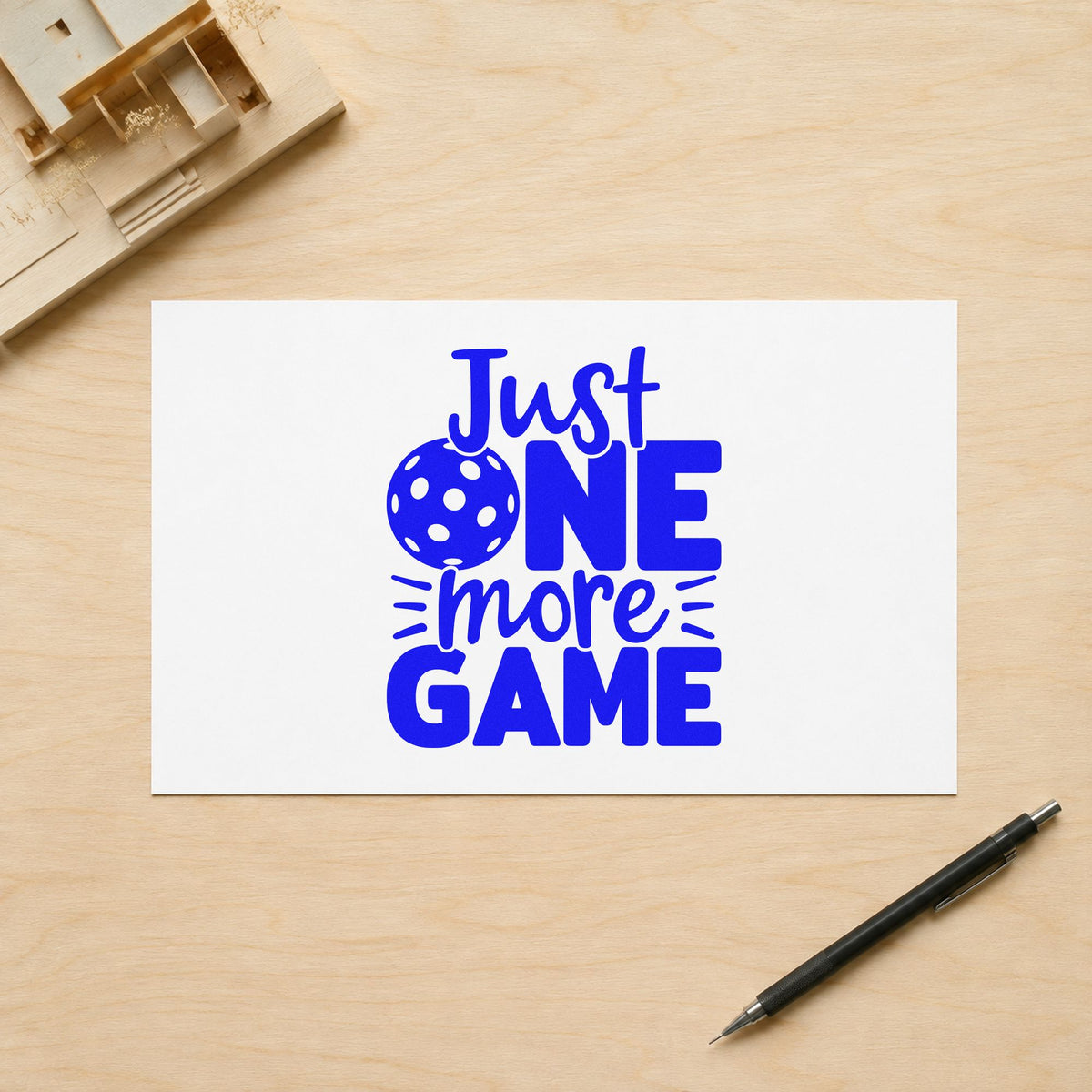 Just One More Game craft stamp imprinted in blue ink on paper, a design suited to framed court post.