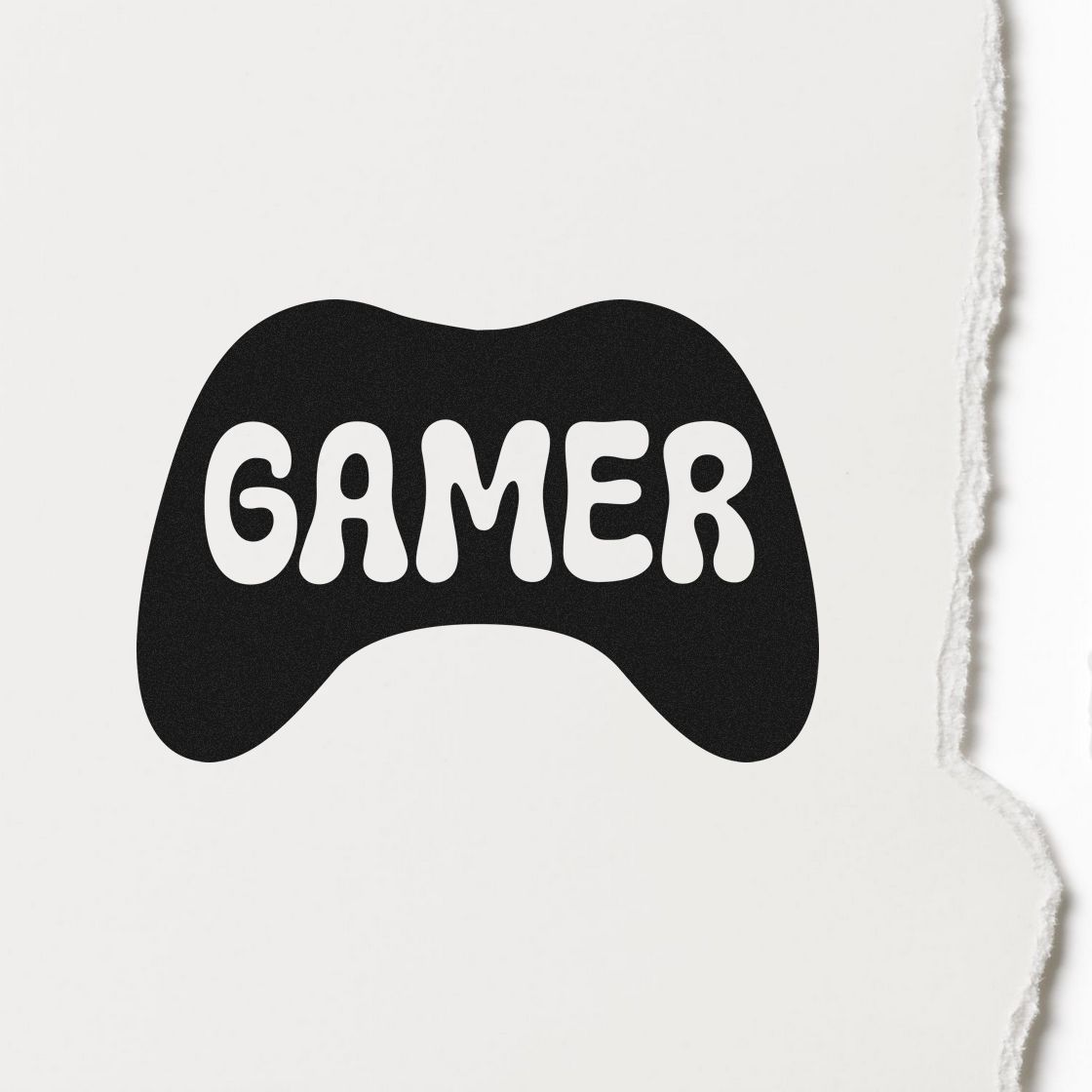 Black gamer controller-shaped stamp seal on white torn-edge paper