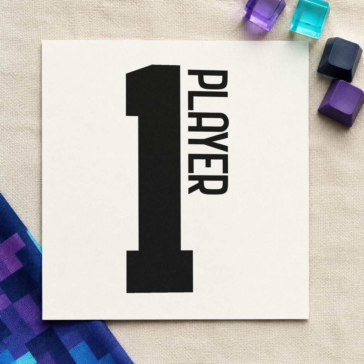 Player One Bold Number craft stamp imprint in black ink on a handmade project, one idea being bed kit gift tags.