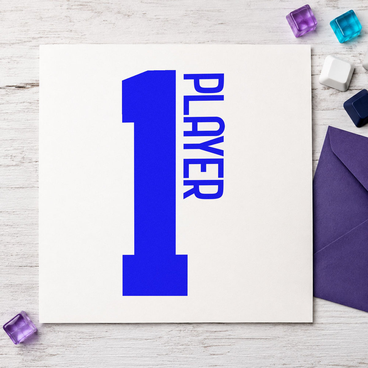 Player One Bold Number craft stamp in blue ink on cardstock, an easy option for pillow case printing.