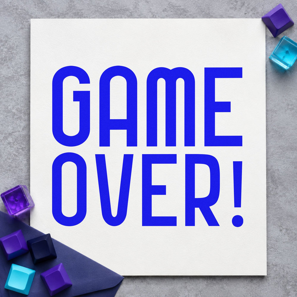 Game Over Tall Lettering craft stamp in blue ink on cardstock, an easy option for party banner printing.