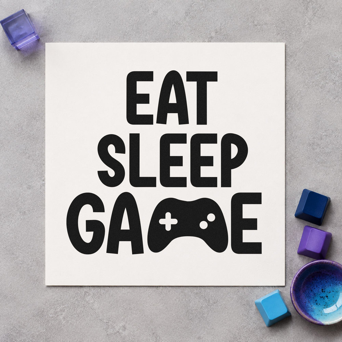 Eat Sleep Game Controller craft stamp imprint in black ink on a handmade project, one idea being supporter gift tags.