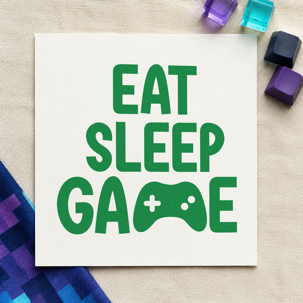 Eat Sleep Game Controller craft stamp imprint in green ink on a handmade project, one idea being donation goal cards.