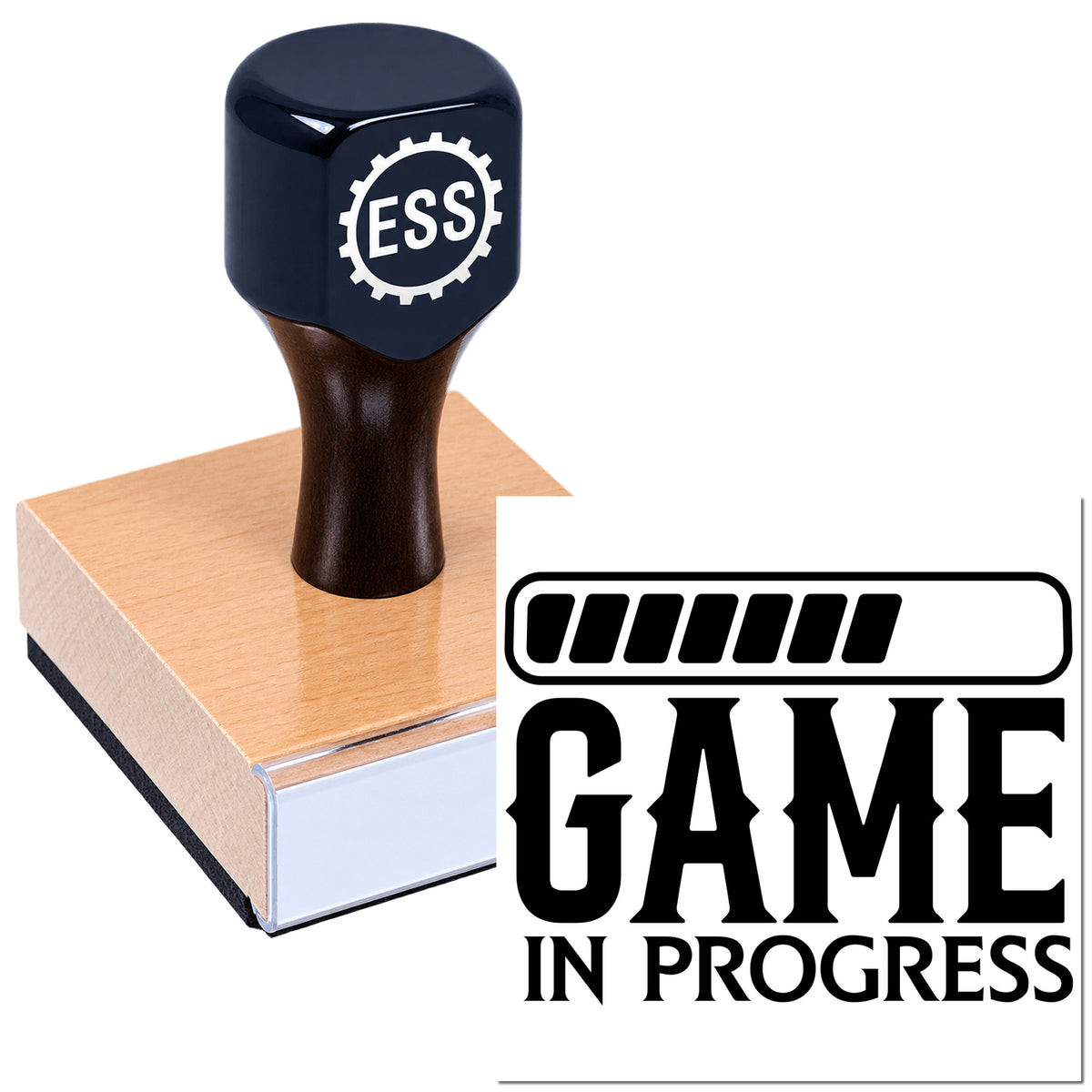 Black ESS rubber stamp on a wooden seal block next to a Game in Progress seal design.