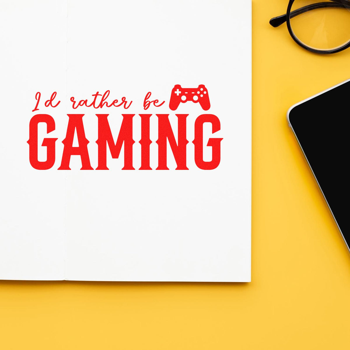 Red gaming stamp and seal design on white paper: Id rather be GAMING with controller icon, on yellow background.