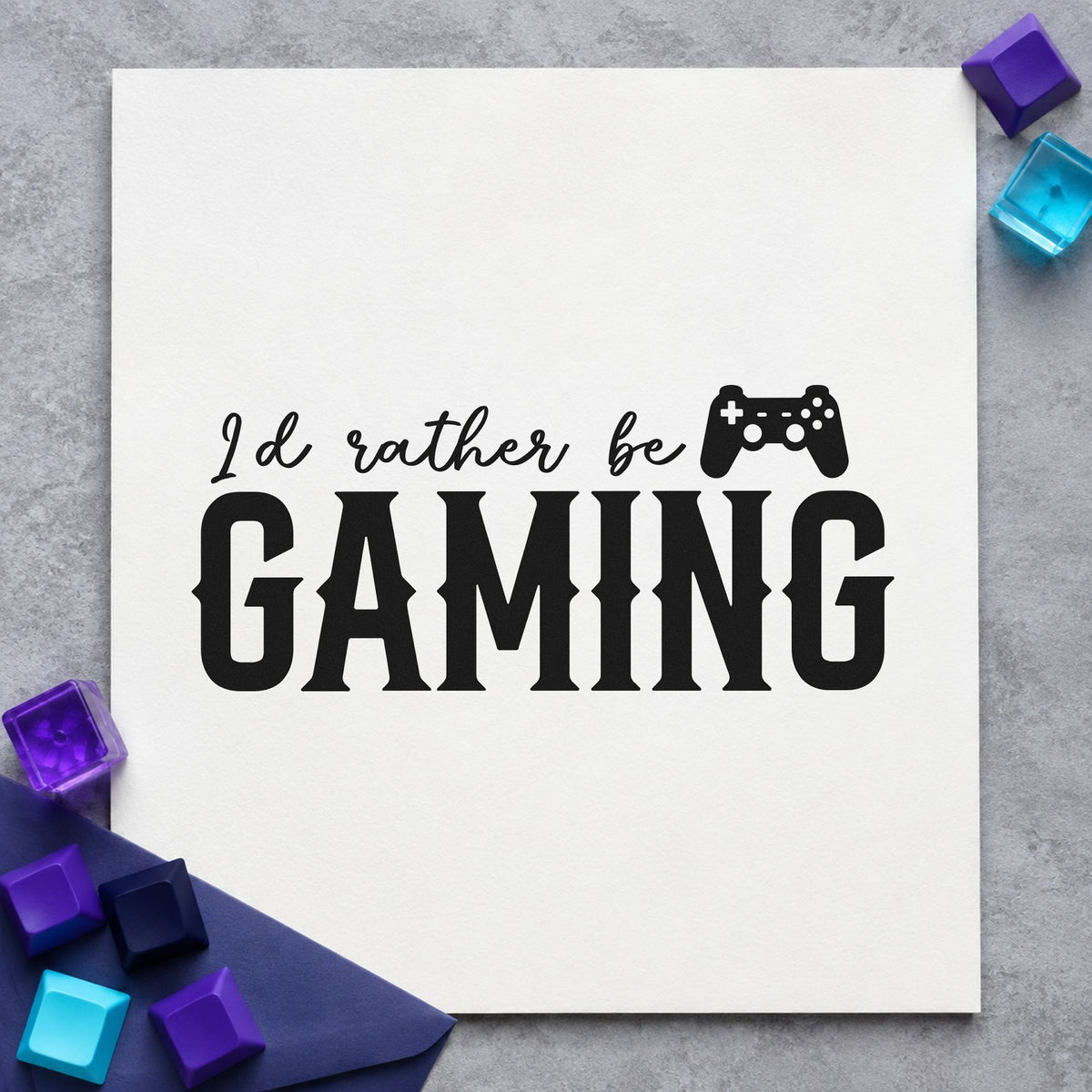 Rather Be Gaming Controller craft stamp imprint in black ink on a handmade project, one idea being desk gift tags.