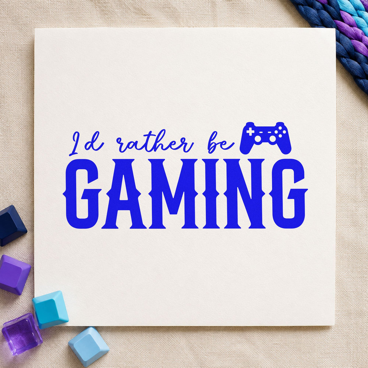 Rather Be Gaming Controller craft stamp in blue ink on cardstock, an easy option for mouse mat printing.