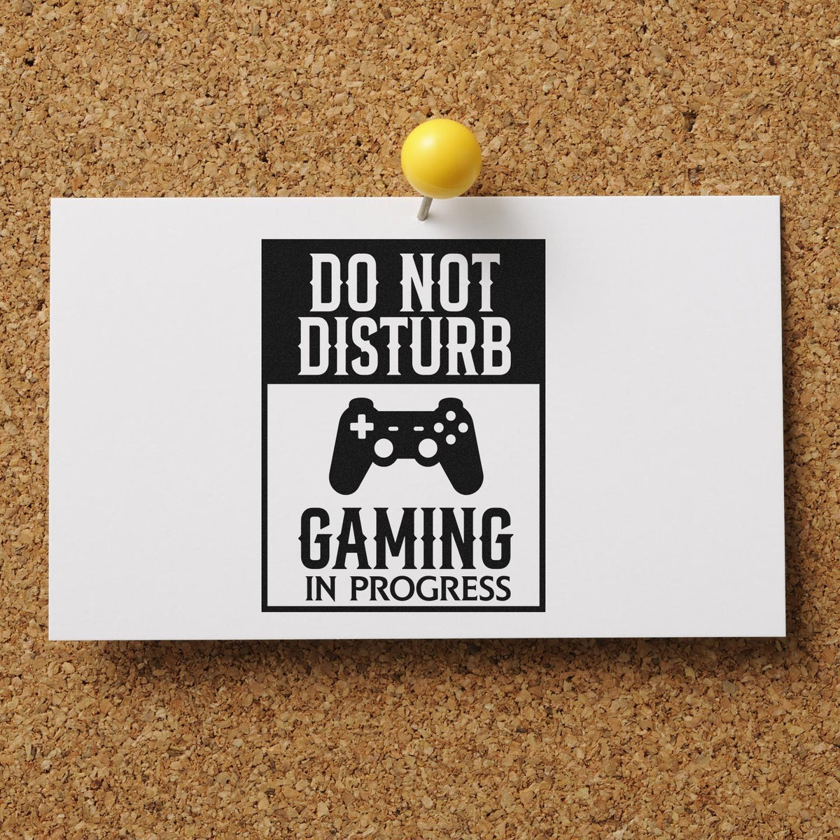 Black-and-white stamp and seal design pinned to corkboard, reading Do Not Disturb Gaming in Progress with yellow pushpin.