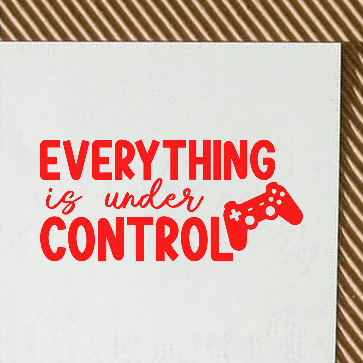 Red stamp-style seal reading Everything is under control with a game controller icon on a white background.