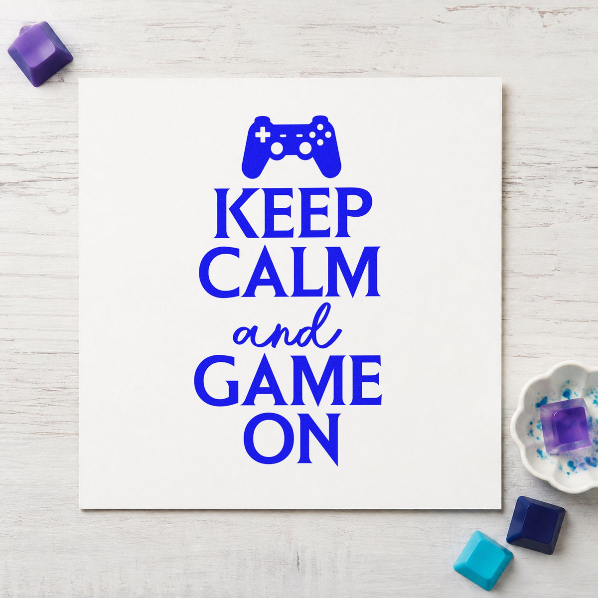 Keep Calm Game On craft stamp in blue ink on cardstock, an easy option for table skirt printing.