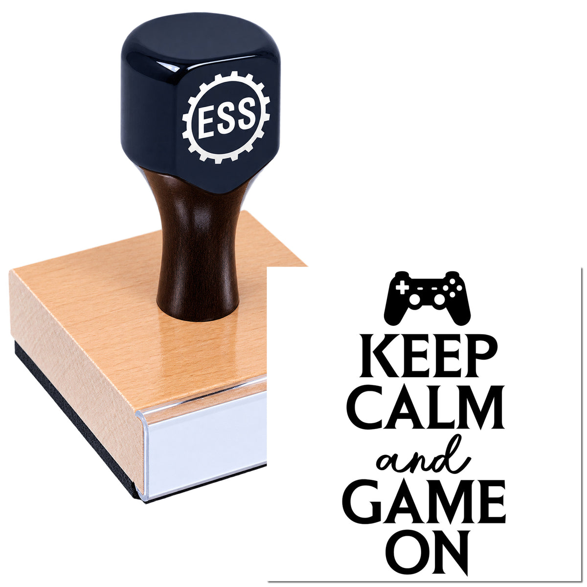 Dark blue ESS stamp and seal on wooden block with game controller icon and "Keep Calm and Game On" text.