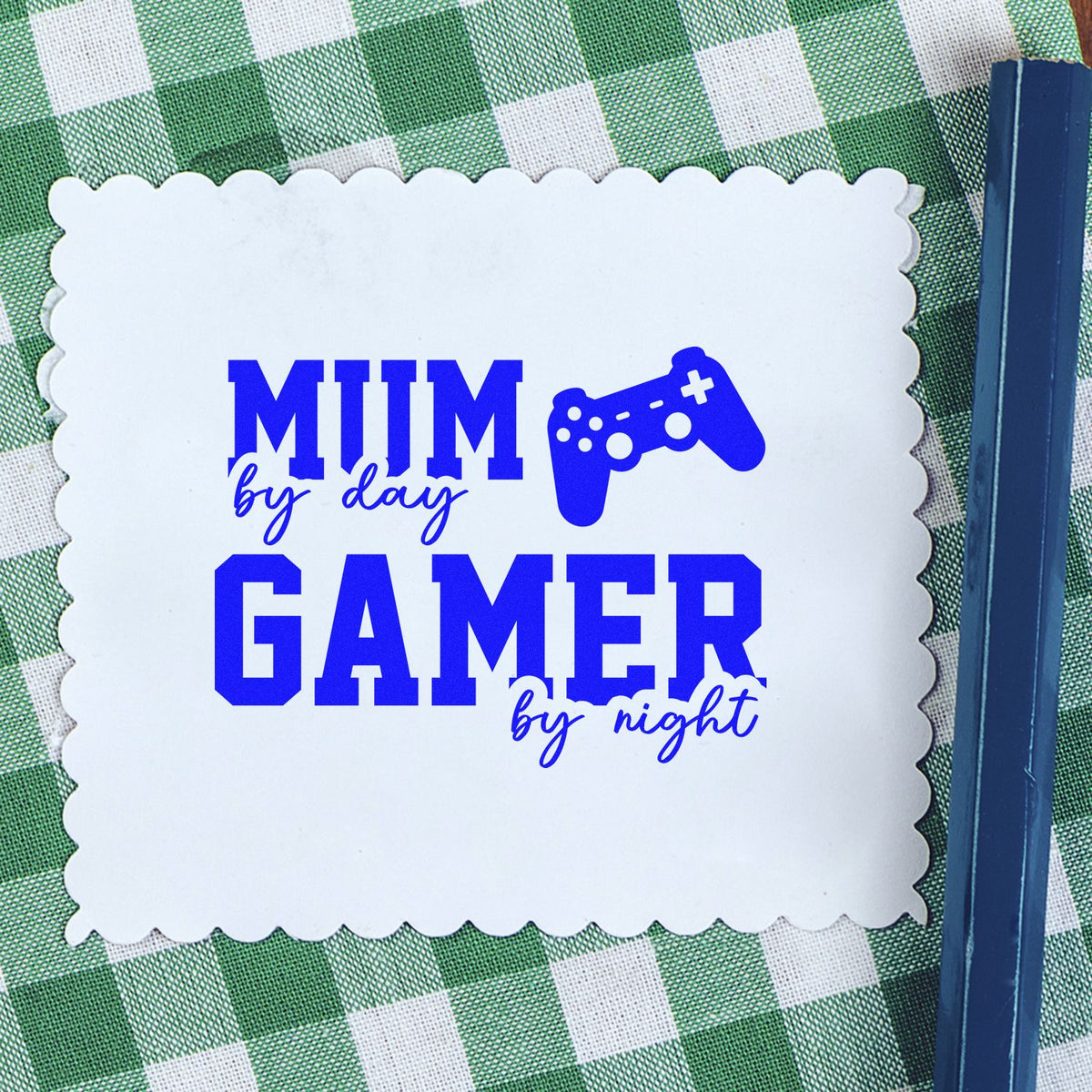 Custom blue stamp and scalloped seal reading MUM by day, GAMER by night on green gingham.