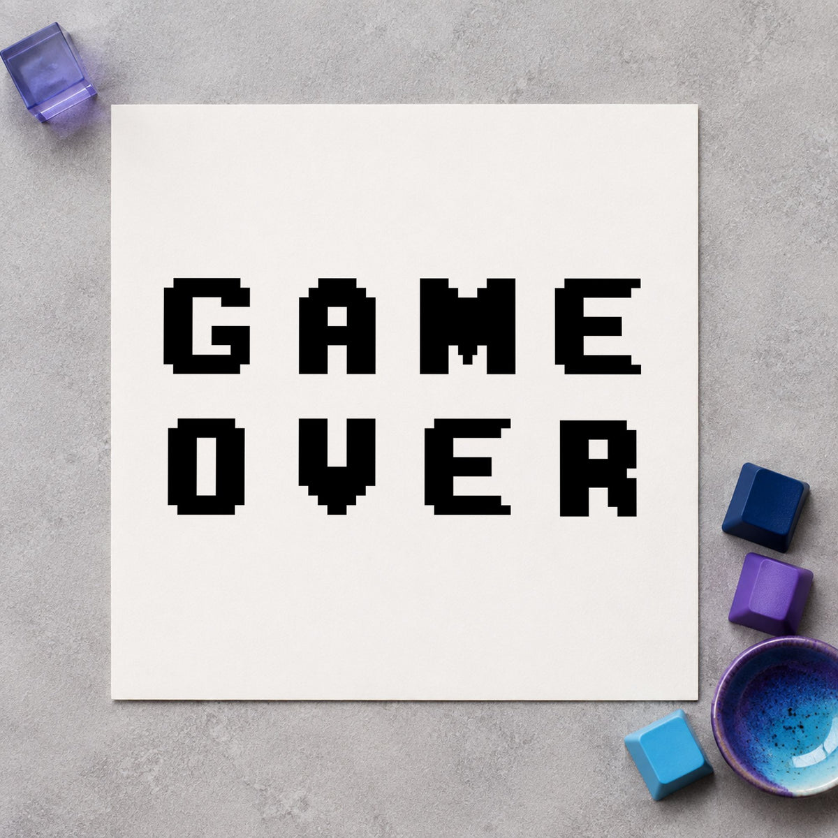 Game Over Pixel Lettering craft stamp imprint in black ink on a handmade project, one idea being trophy gift tags.