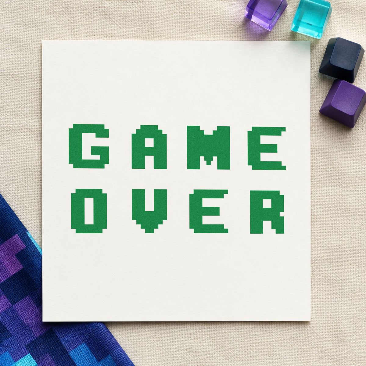 Game Over Pixel Lettering craft stamp imprint in green ink on a handmade project, one idea being match order cards.