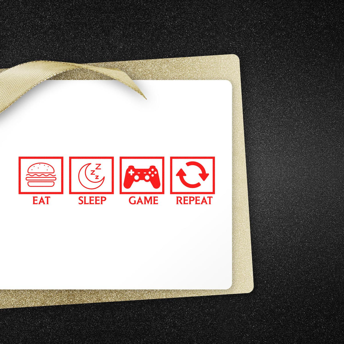 Red stamp-style seal design for eat, sleep, game, repeat on a white card with gold ribbon and black textured background.