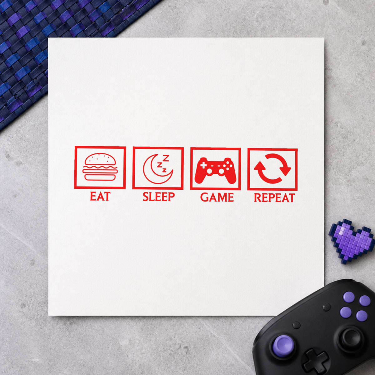 Eat Sleep Game Repeat rubber stamp shown in red ink, stamped for projects such as bin storage labels.