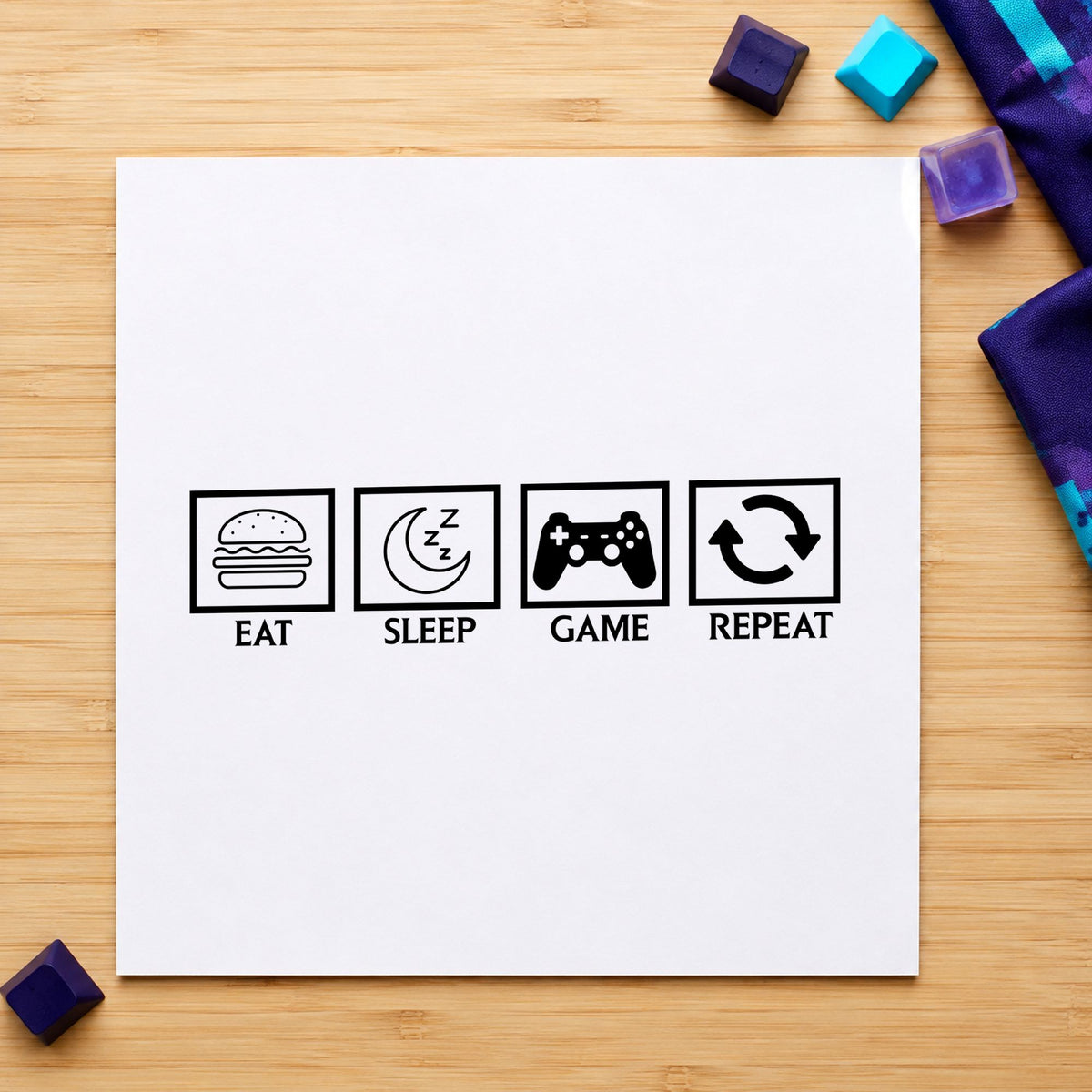 Eat Sleep Game Repeat rubber stamp printed in black ink, ready for four icon cards and similar paper crafts.