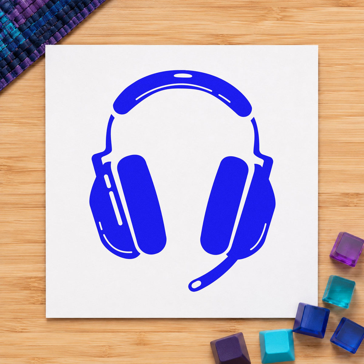 Gaming Headset With Microphone craft stamp in blue ink on cardstock, an easy option for arm sleeve printing.