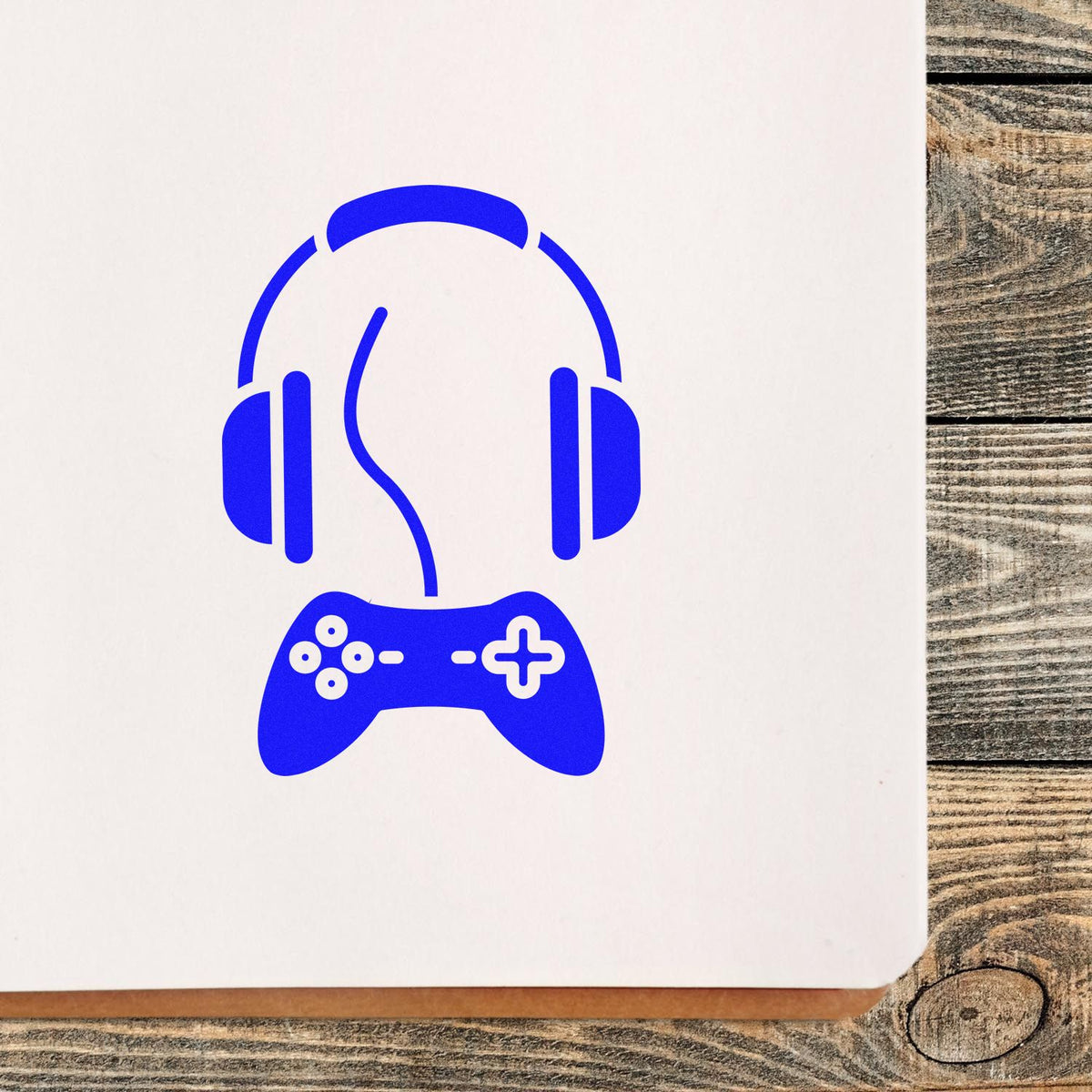 Blue headphones and game controller stamp/seal design on white paper, with clean modern icon