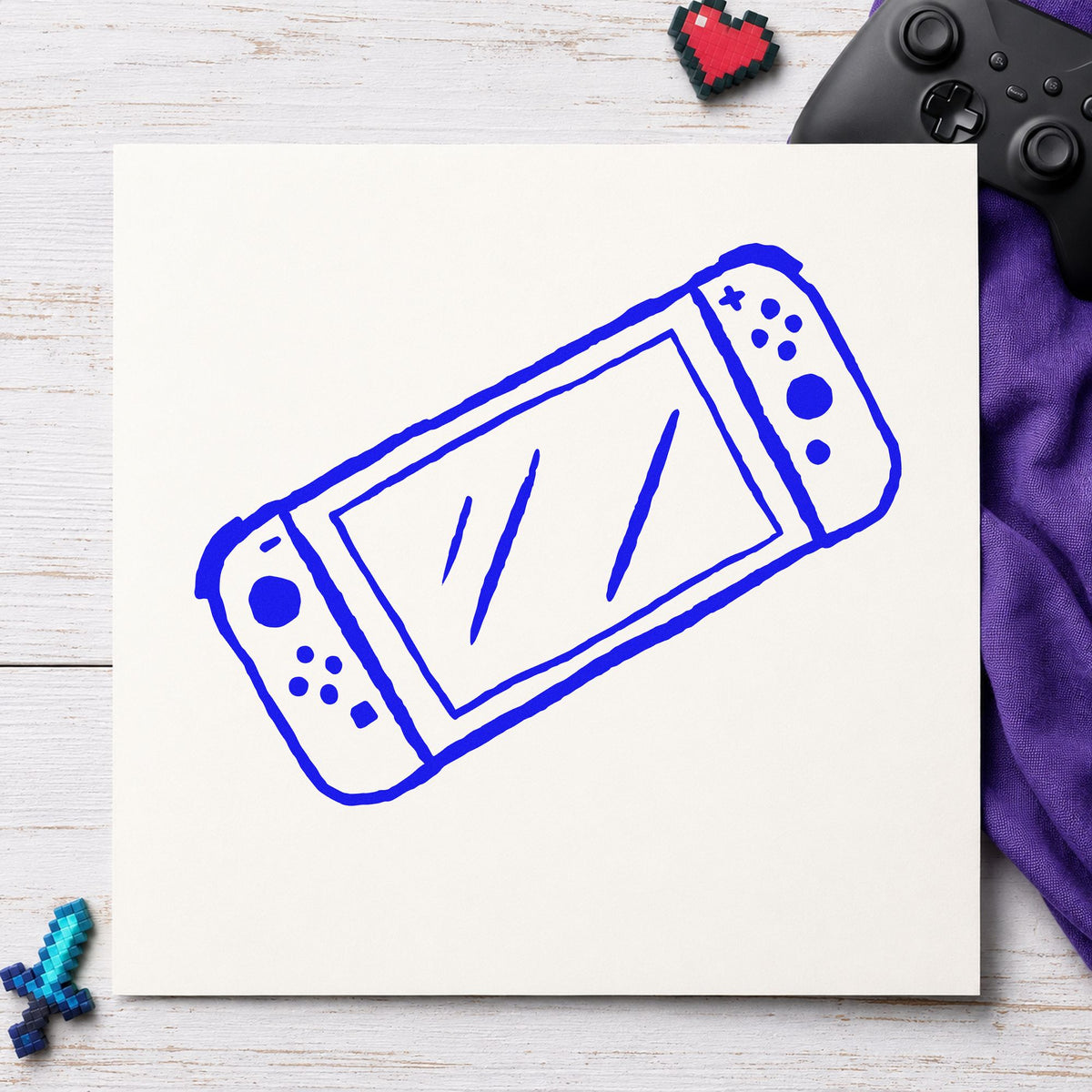 Handheld Gaming Console Outline craft stamp imprinted in blue ink on paper, a design suited to framed hall shelf.