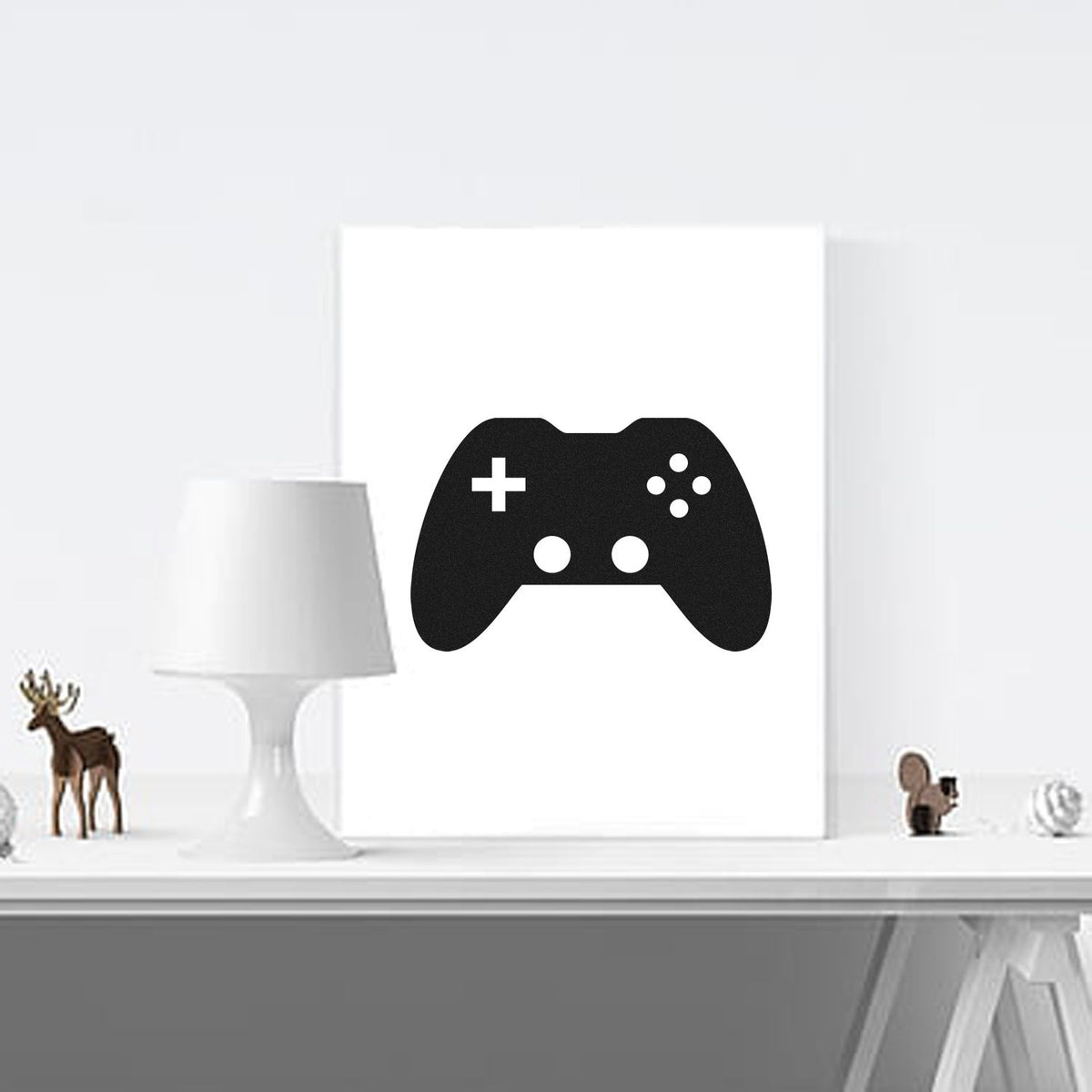 Black game controller stamp and seal design on white canvas, with plus symbol and white button dots.