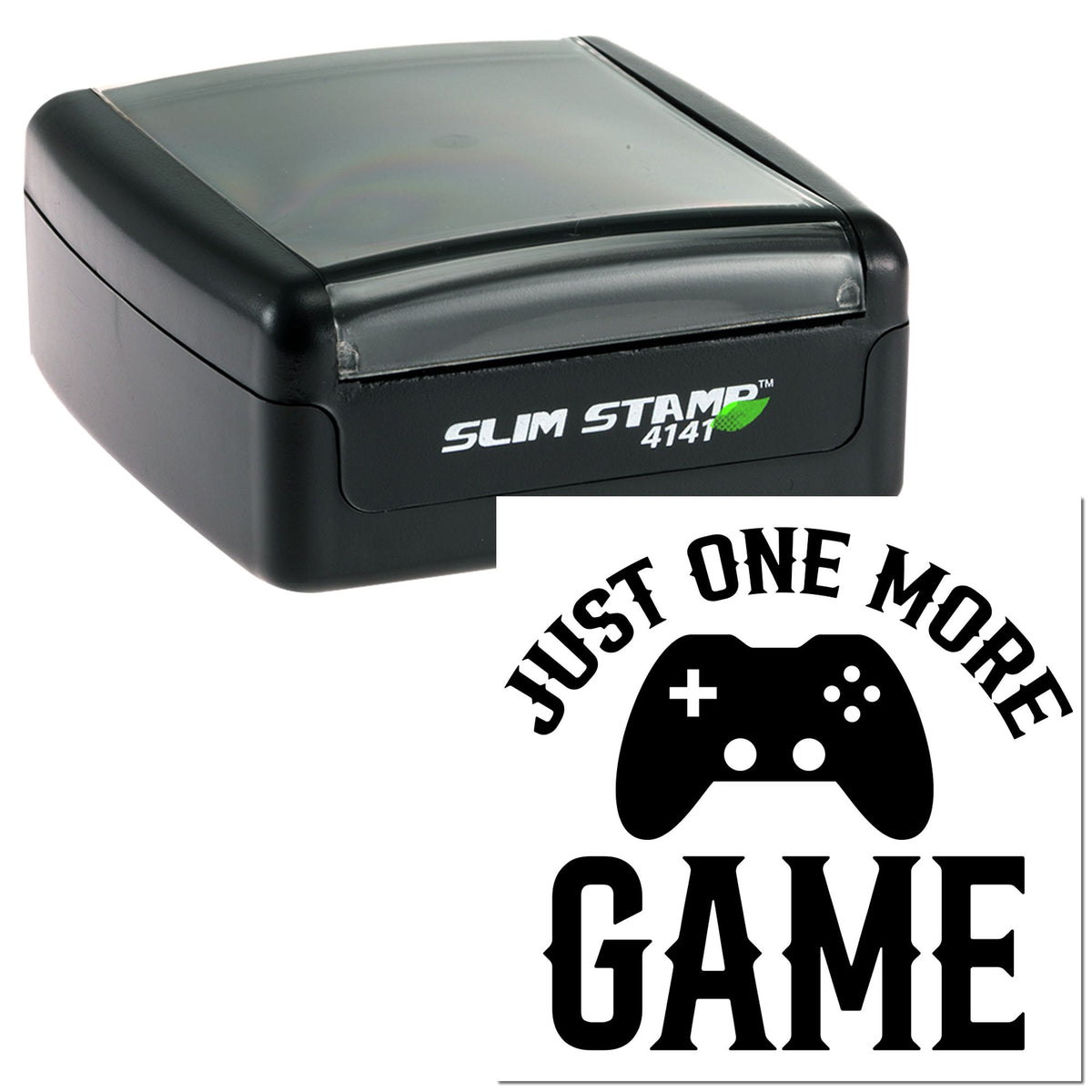 Black slim self-inking stamp with translucent gray lid, showing a Just One More Game seal with game controller icon.