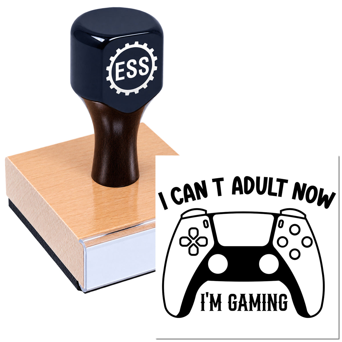 Black ESS stamp and seal on wooden block, printing a gaming controller and "I CAN'T ADULT NOW, I'M GAMING" design.