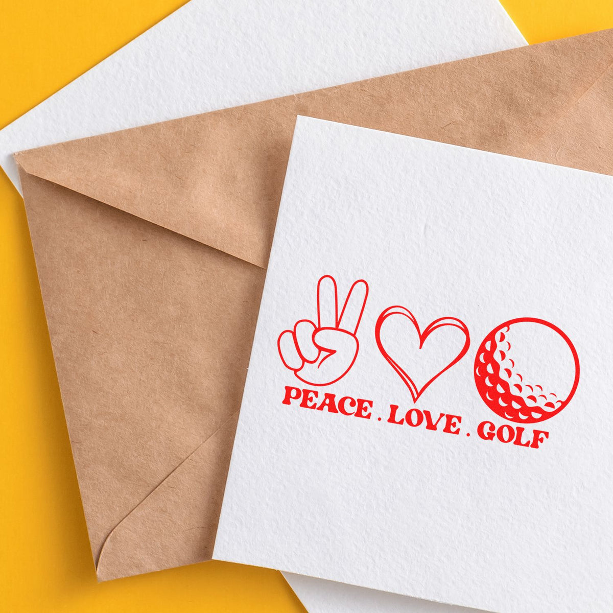 White stamp card with red Peace, Love, Golf design, featuring a peace sign, heart, and golf ball on a brown envelope, yellow background