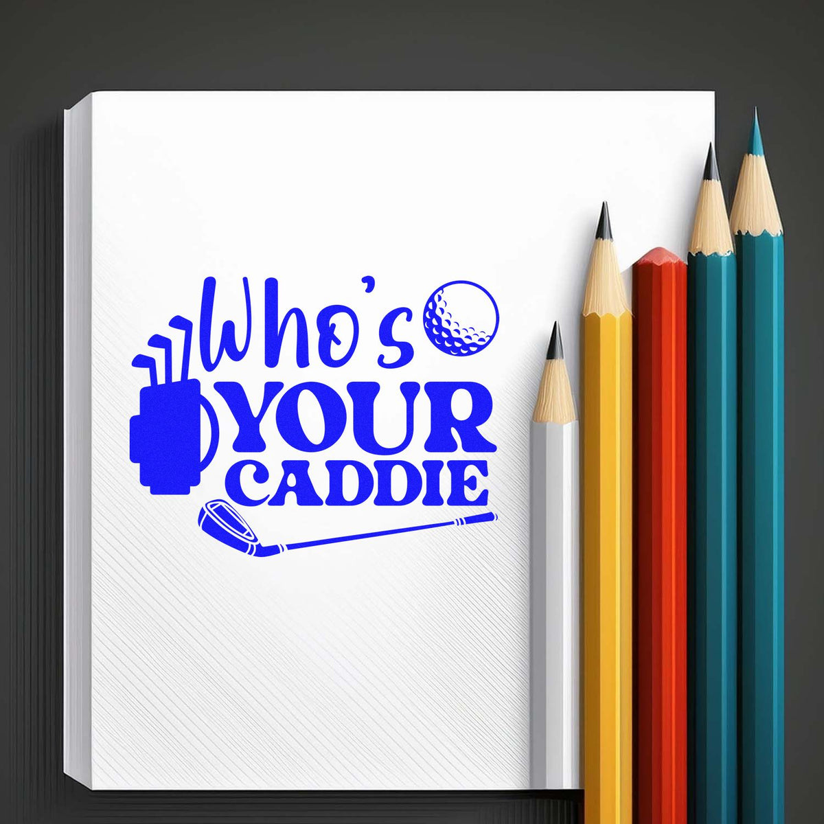 Blue custom stamp and seal design with golf logo on a white notepad, beside colored pencils.