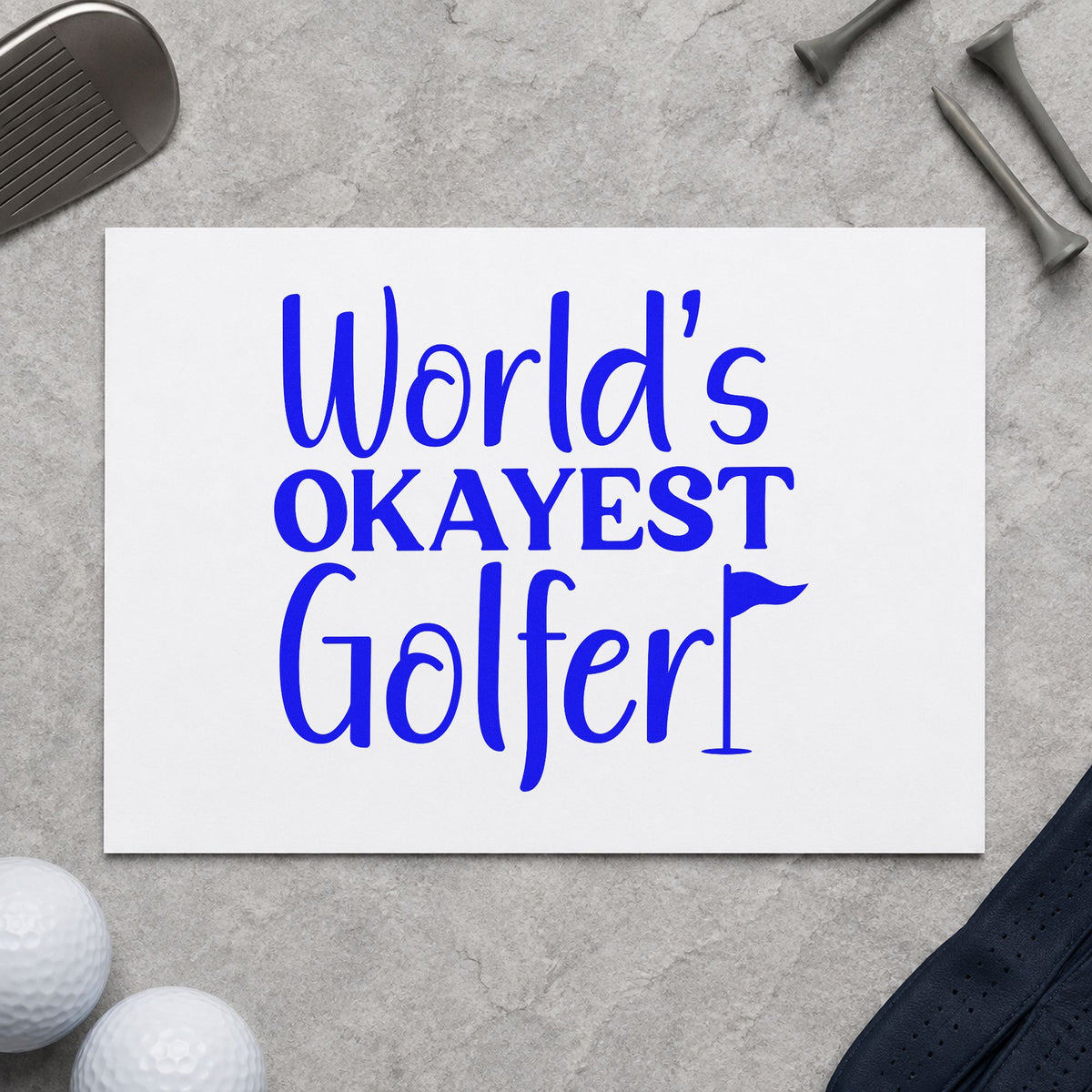 Worlds Okayest Golfer Quote craft stamp in blue ink on cardstock, an easy option for bag towel printing.