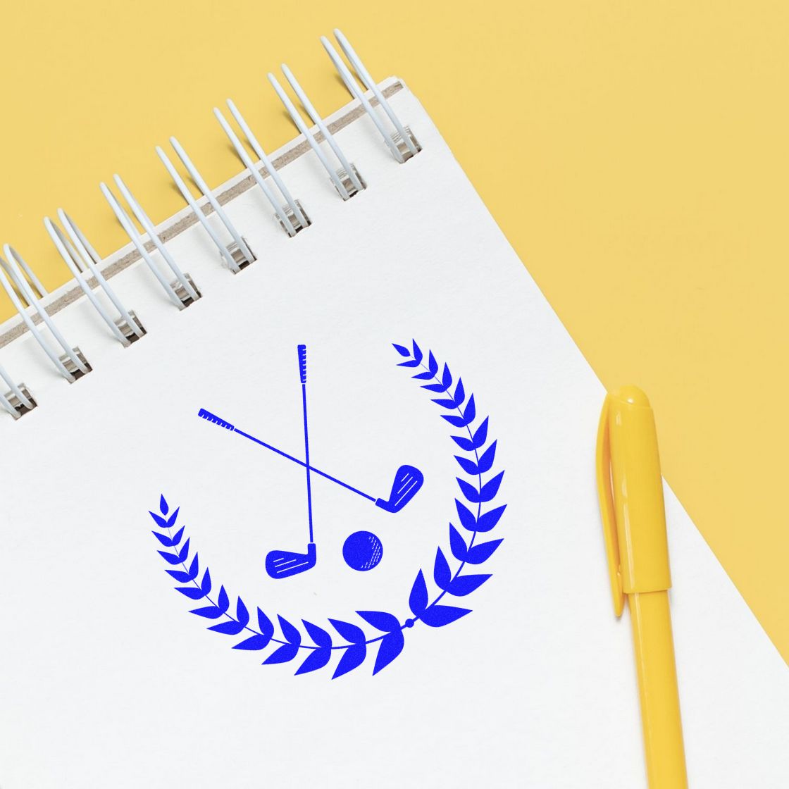 Blue golf stamp seal with clubs and laurel on a white spiral notebook, beside a yellow pen on a yellow background.