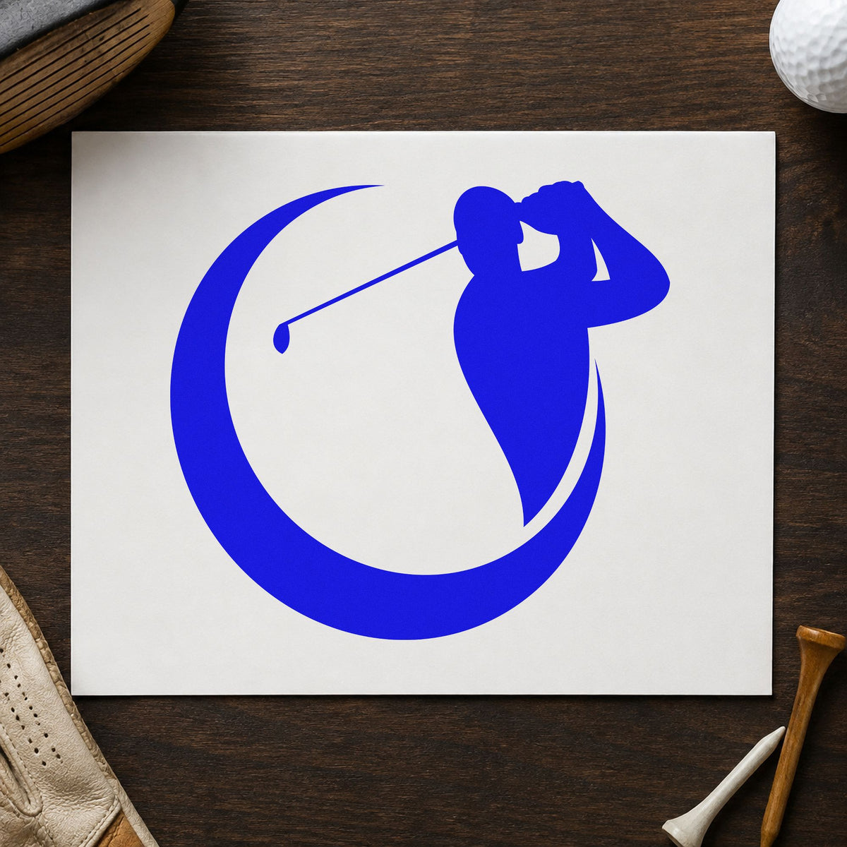 Golfer Crescent Circle Silhouette craft stamp imprinted in blue ink on paper, a design suited to framed studio bay.